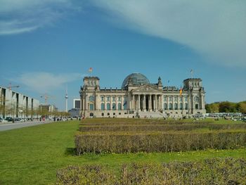 Facade of historic reichstag building against sky