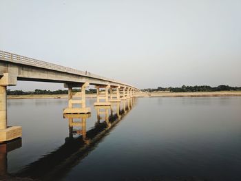 Bridge over river against clear sky