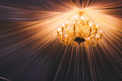 Low angle view of illuminated chandelier