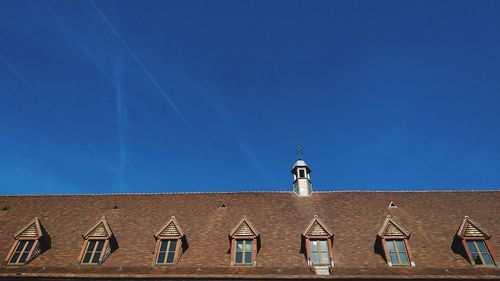 Low angle view of building against blue sky