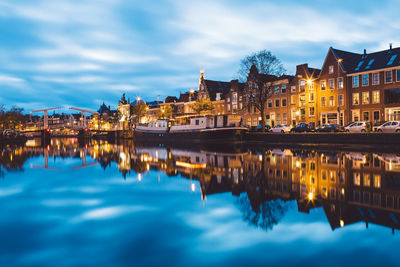 Reflection of illuminated buildings in water