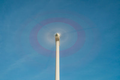 Low angle view of wind turbine against sky