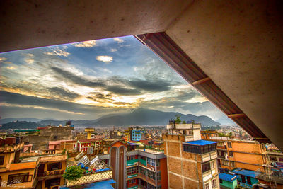 Cityscape against sky seen through window