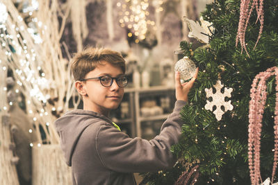 Portrait of man with christmas tree