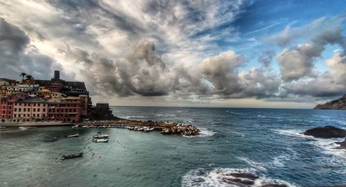 Scenic view of sea and buildings against sky