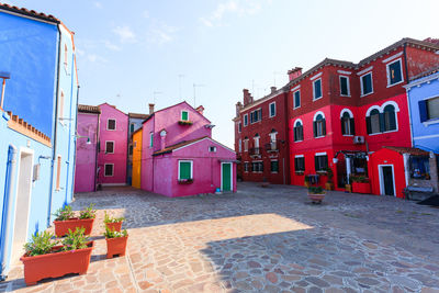 Buildings in city against sky