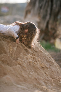 Girl playing on sand