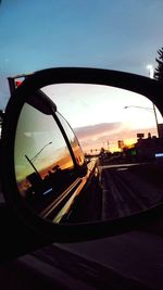 Reflection of sky on side-view mirror