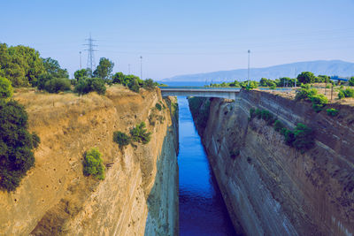 Scenic view of river against clear blue sky