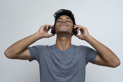 Low angle view of man using mobile phone