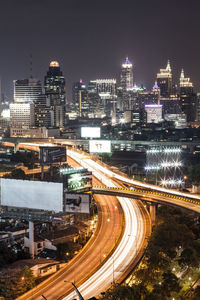 High angle view of light trails on road at night