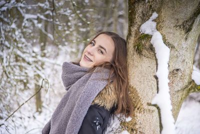 Portrait of a smiling young woman during winter