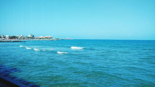 Scenic view of sea against clear blue sky