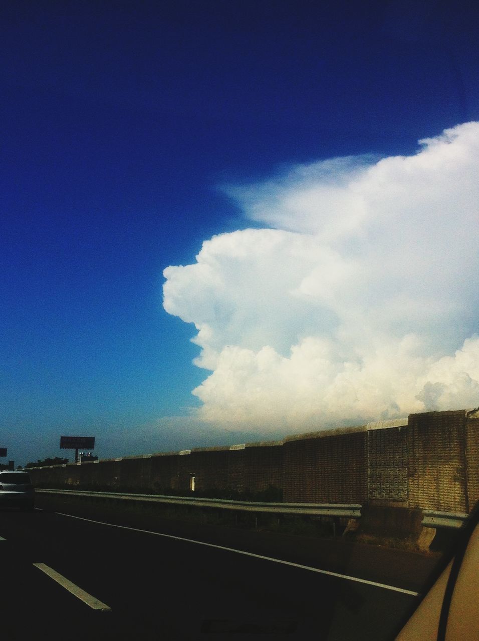 transportation, sky, road, blue, cloud - sky, road marking, landscape, highway, mode of transport, cloud, car, land vehicle, nature, no people, the way forward, street, outdoors, day, scenics, built structure