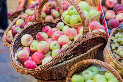 An assortment of ripe fruits in baskets and boxes at the russian farmer's market