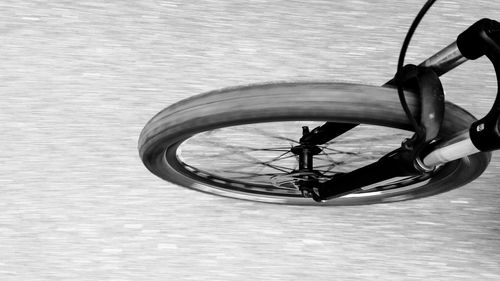 Low section of man with bicycle in water