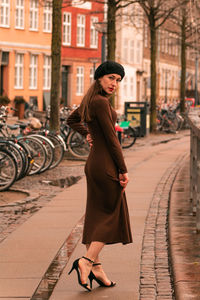 Rear view of woman walking on street