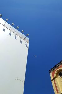 Low angle view of building against blue sky