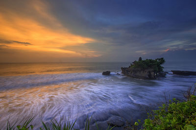 Scenic view of sea against sky during sunset