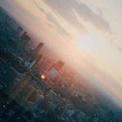 Aerial view of city at sunset