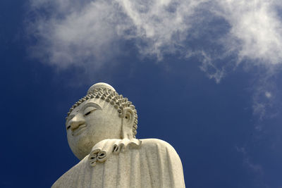 Low angle view of statue against blue sky