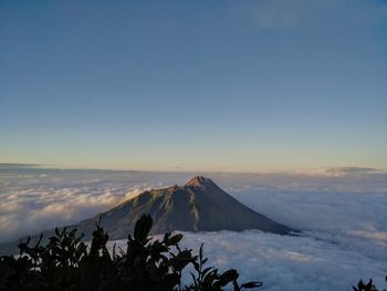 Scenic view of volcanic landscape against sky during sunset