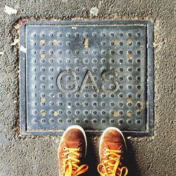 Directly above shot of human feet on tiled floor