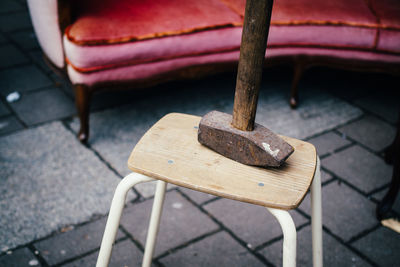 High angle view of hammer on stool at street