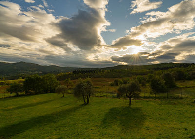 Scenic view of landscape against sky during sunset