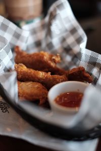 Close-up of fried chicken with sauce on table