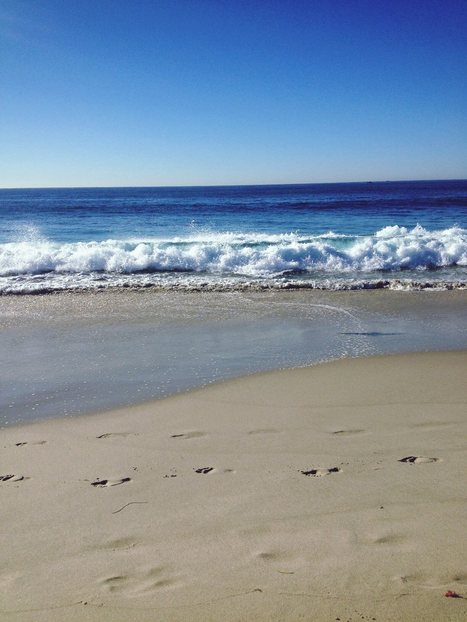 sea, beach, horizon over water, clear sky, water, sand, copy space, shore, wave, scenics, tranquil scene, tranquility, beauty in nature, surf, nature, blue, idyllic, coastline, remote, day