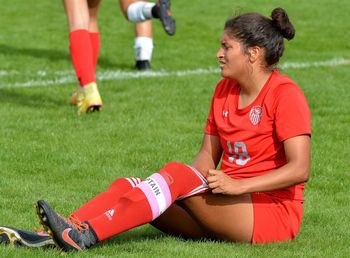 Full length of friends on soccer field