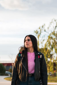 Portrait of a university student walking on the campus