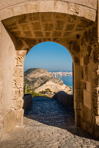 Hill against sky seen from santa barbara castle arch