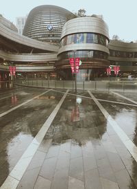 Reflection of building on wet glass