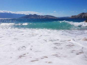 Scenic view of sea against blue sky