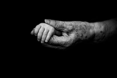 Close-up of hand in darkroom