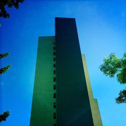 Low angle view of built structure against clear blue sky
