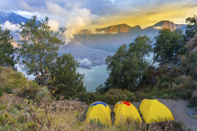 Scenic view of mountains against cloudy sky