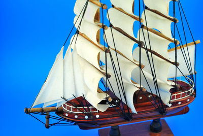 High angle view of ship model against blue background