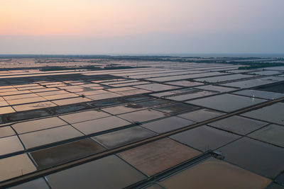 Aerial view of building against sky during sunset