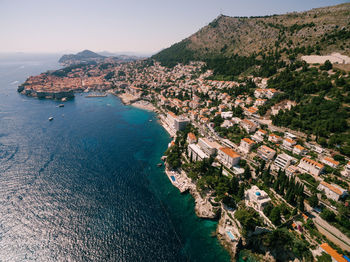 High angle view of townscape by sea