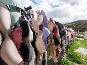 Panoramic view of clothes hanging against sky