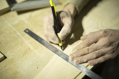 Cropped image of man working at workshop