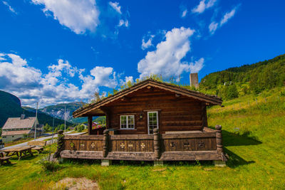 Built structure on field against sky