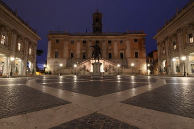 Illuminated buildings in city at night