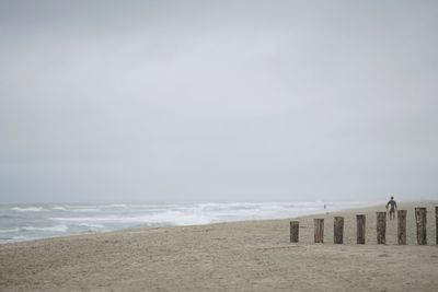 Scenic view of beach against clear sky