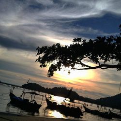 Scenic view of calm sea against cloudy sky