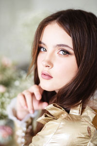 Close-up portrait of a young woman in a retro dress. dark hair