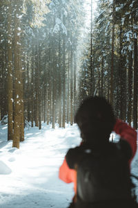 Rear view of woman on snow covered land